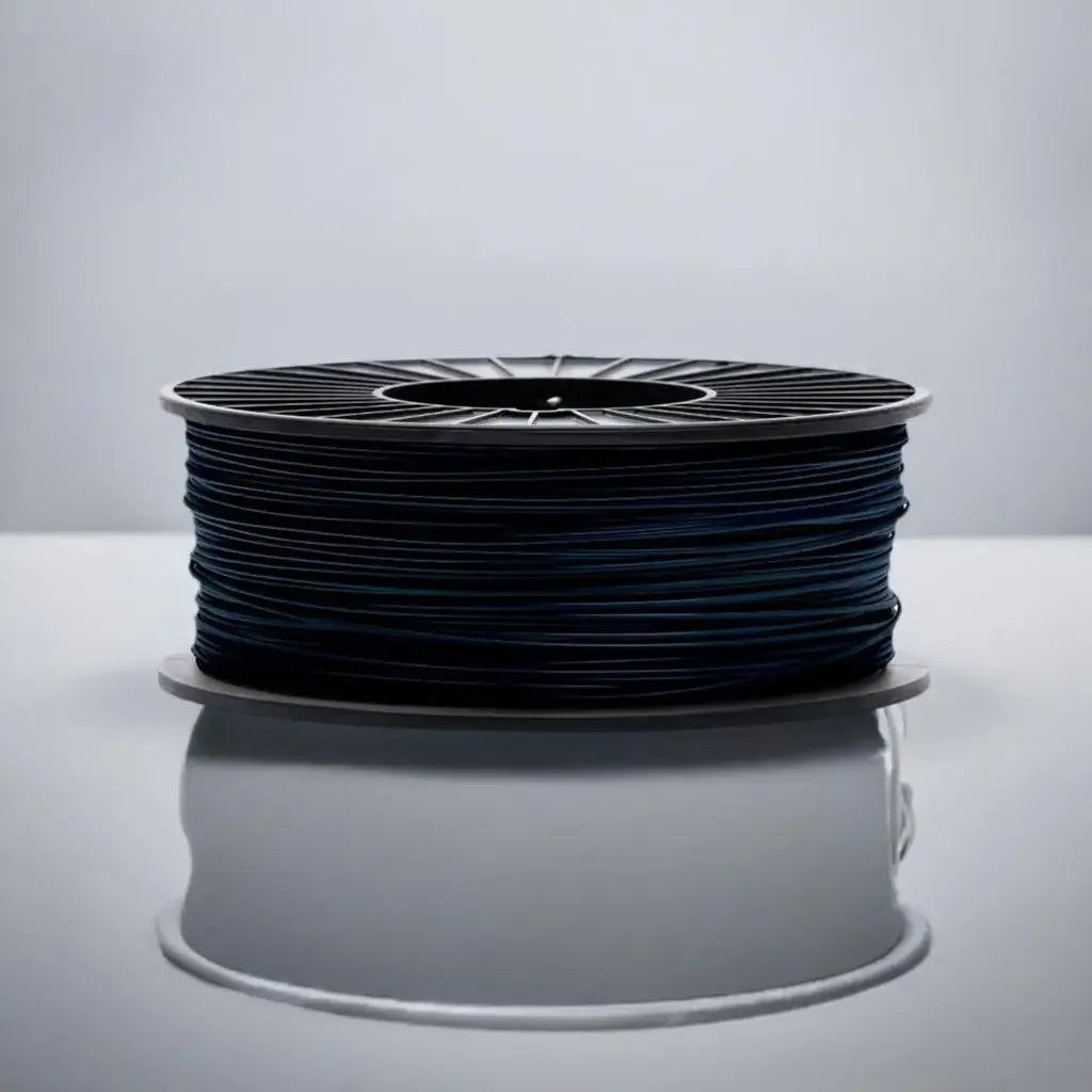 Black CoexFlex 60D TPE 3D printer filament spool on white surface