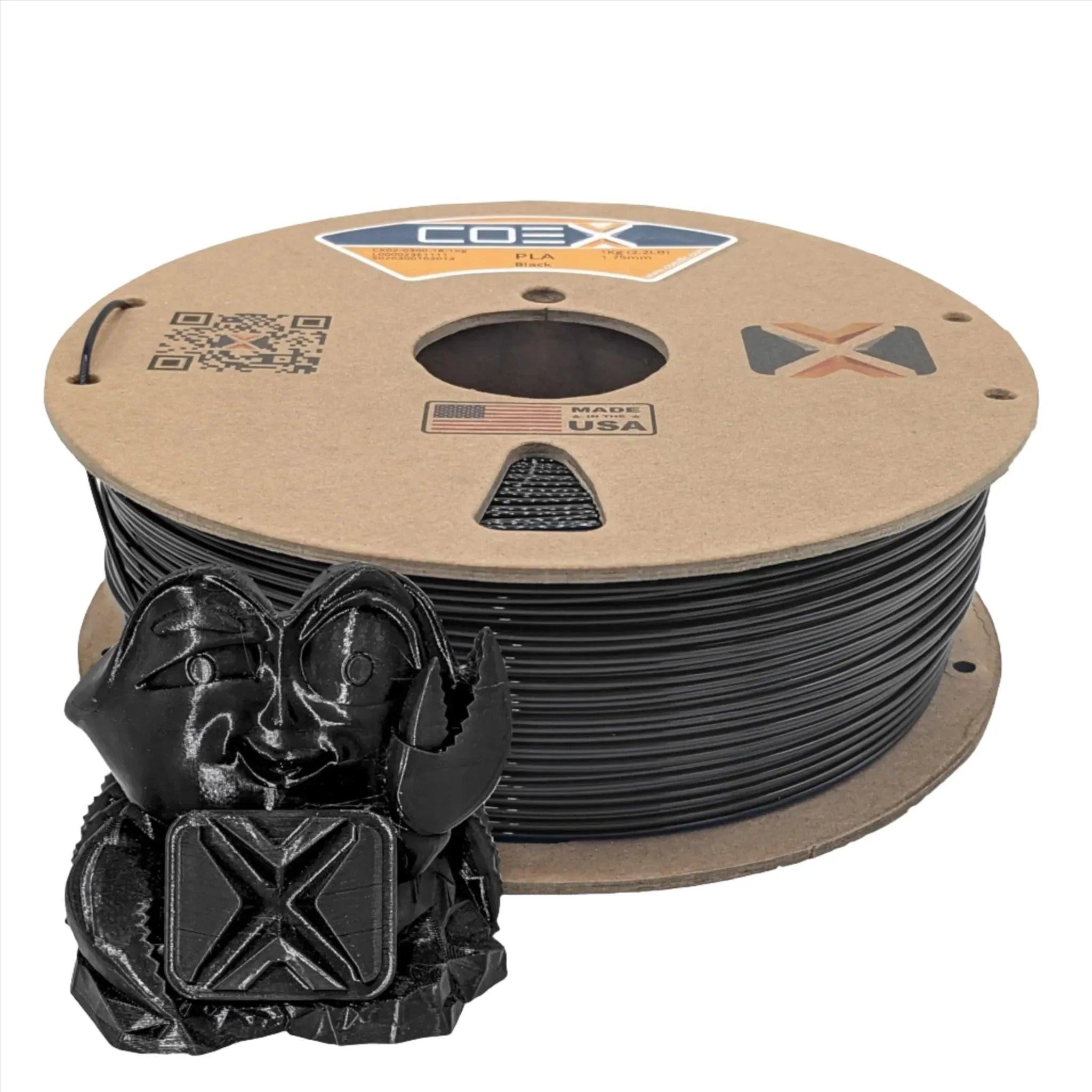 Black PLA 3D printer filament spool with a small black 3D printed model in front.
