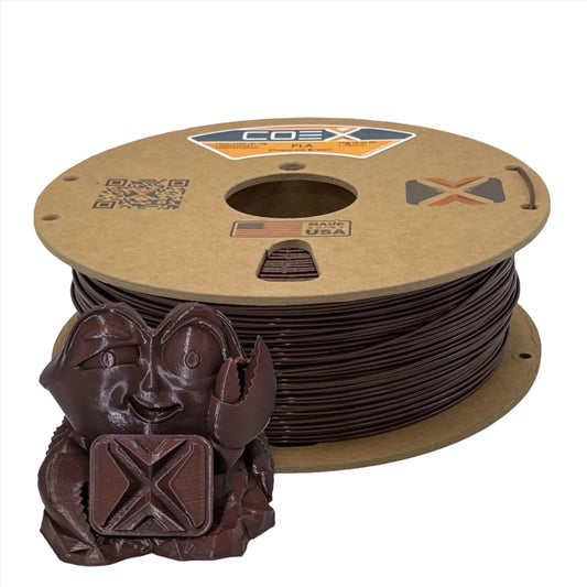Chocolate brown PLA 3D printer filament spool with a small crab figurine