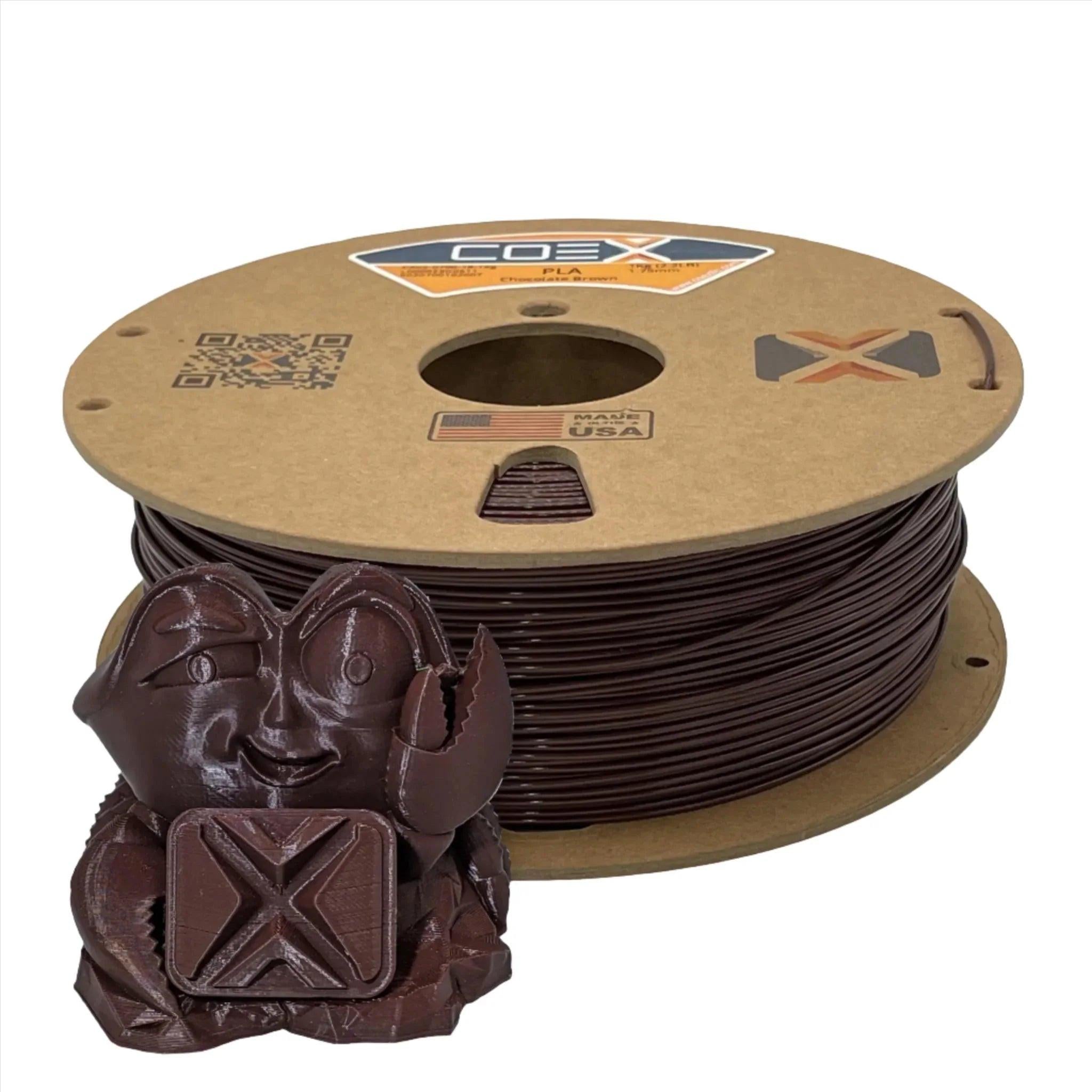 Chocolate brown PLA 3D printer filament spool with a small crab figurine