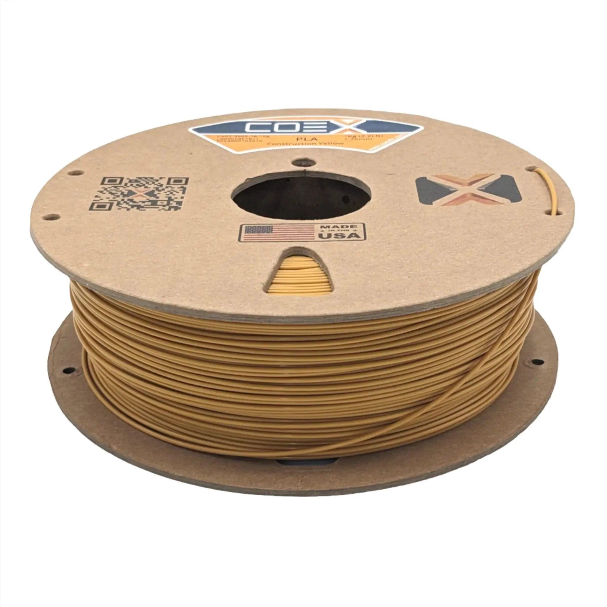Construction yellow PLA 3D printer filament spool with cardboard packaging