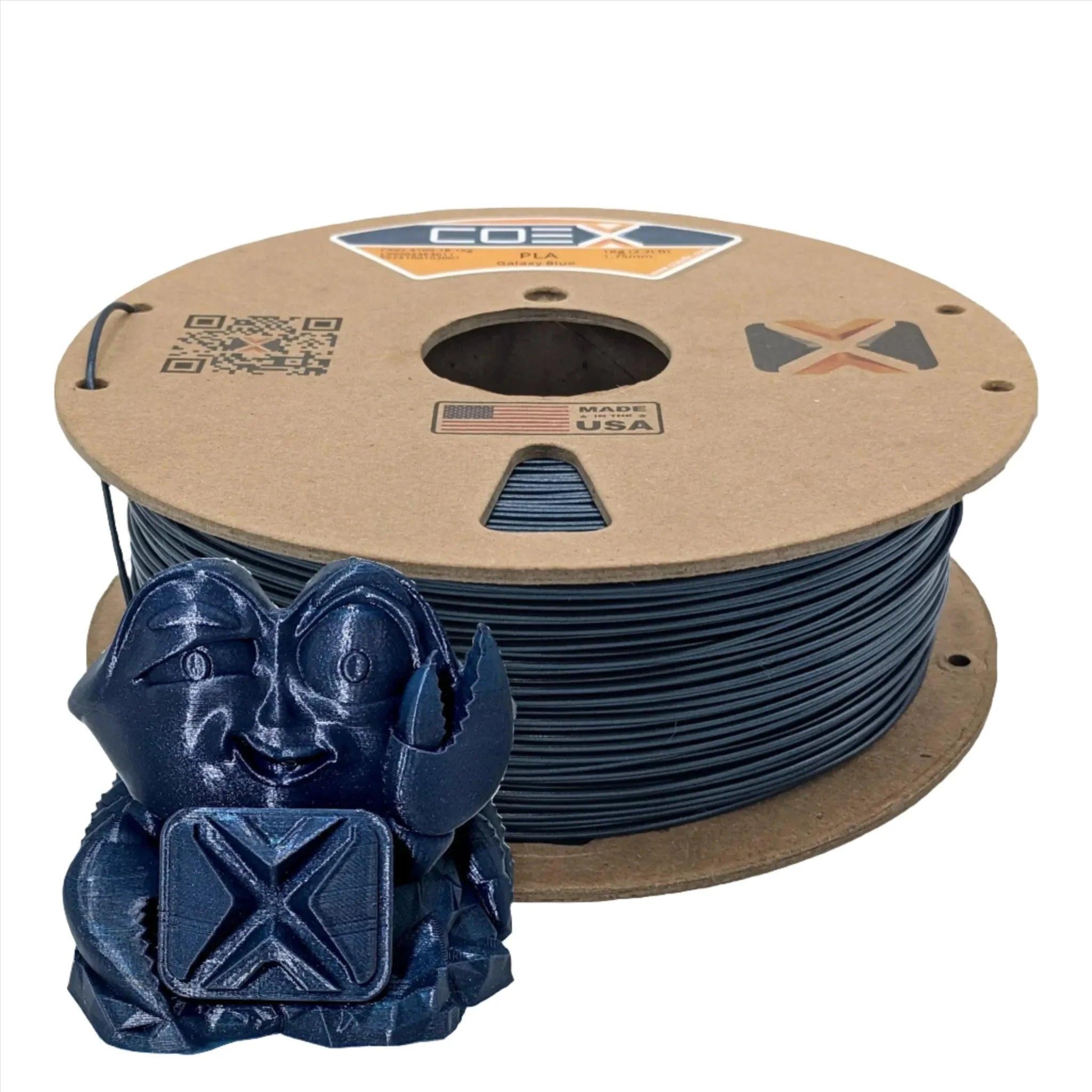 Galaxy Blue PLA 3D printer filament spool with a blue 3D printed crab figurine