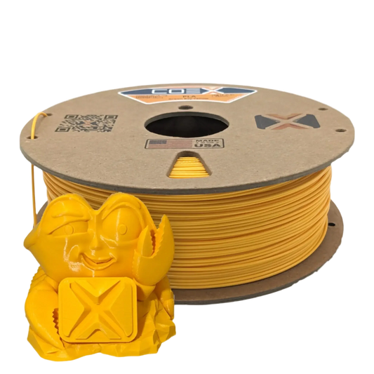 Yellow COEX 3D PLA filament spool with a 3D printed crab figurine in front