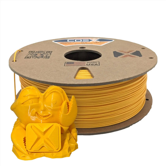 Yellow PLA 3D printer filament spool with small yellow 3D printed crab figure in front