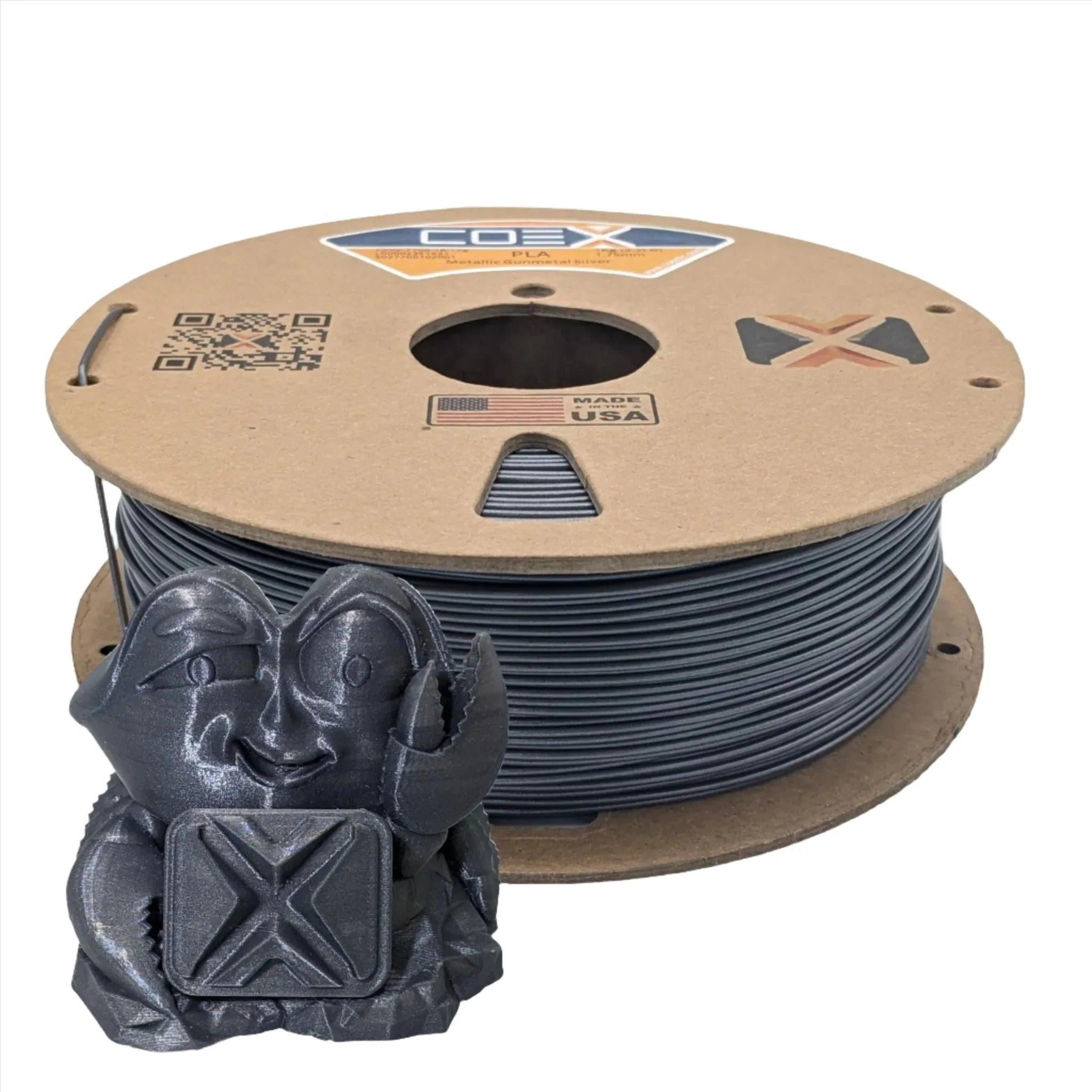Metallic gunmetal silver PLA 3D printer filament spool with 3D printed model in front