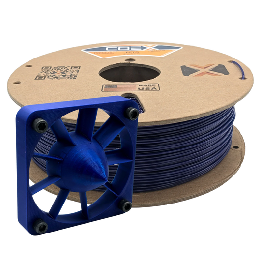 Spool of PETG blueberry 3D printer filament with a blue 3D printed part
