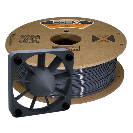 COEX PETG gunmetal grey 3D printer filament spool with a printed fan part in front