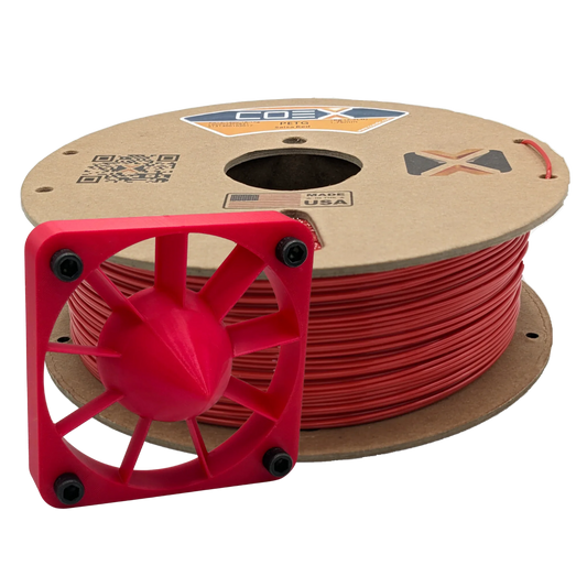 Spool of red PETG 3D printer filament with printed cooling fan part