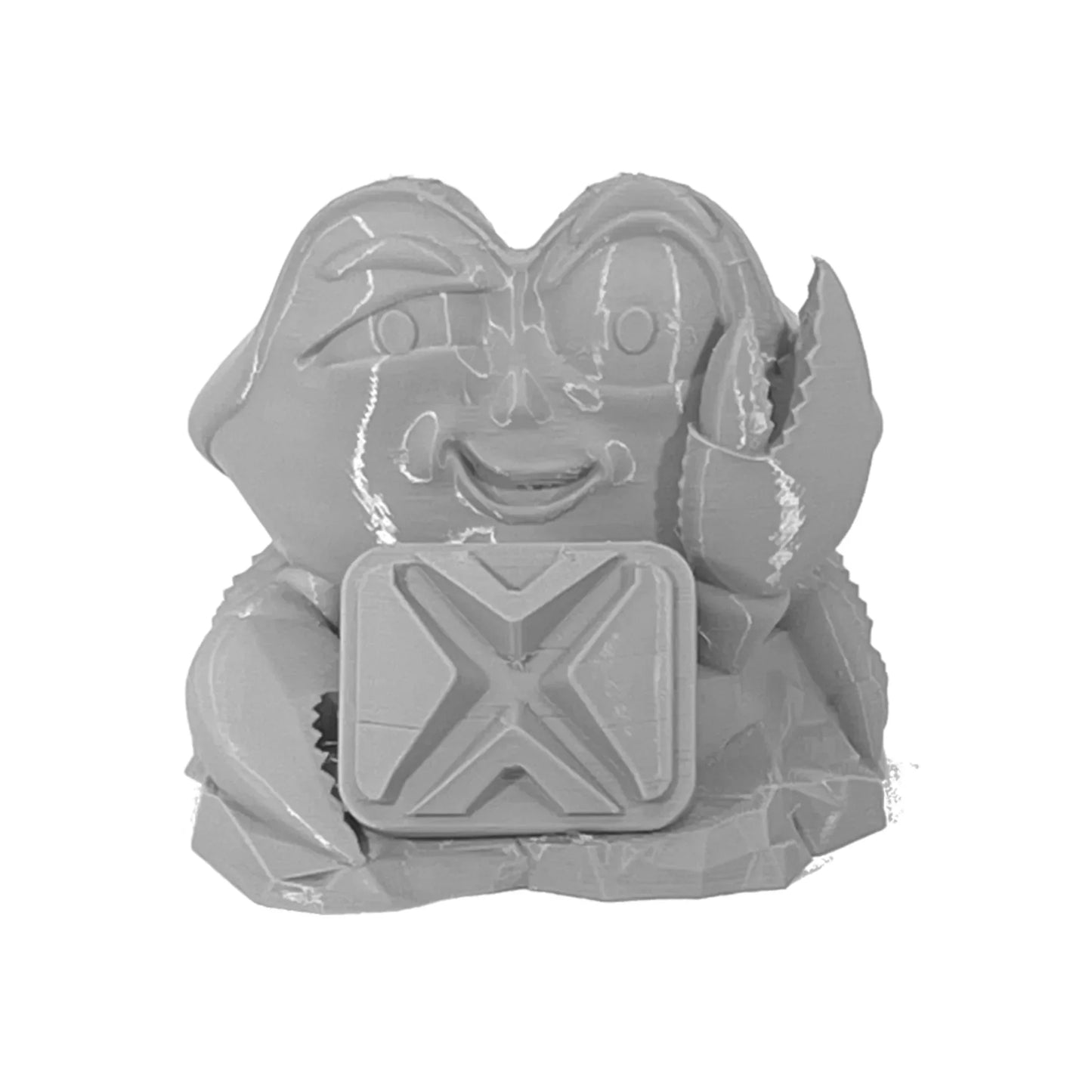 Gray crab figurine with smiling face and claw, holding a block embossed with an X symbol