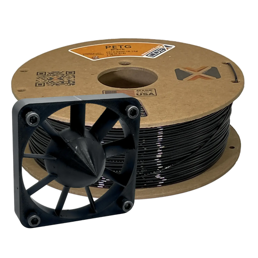 Black PETG 3D printer filament spool with a 3D printed fan model in front