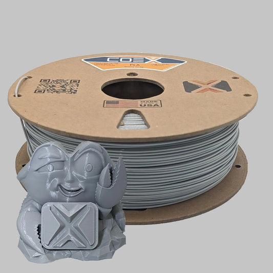 Eco-friendly chipboard spool with gray COEX 3D printer filament and 3D printed model