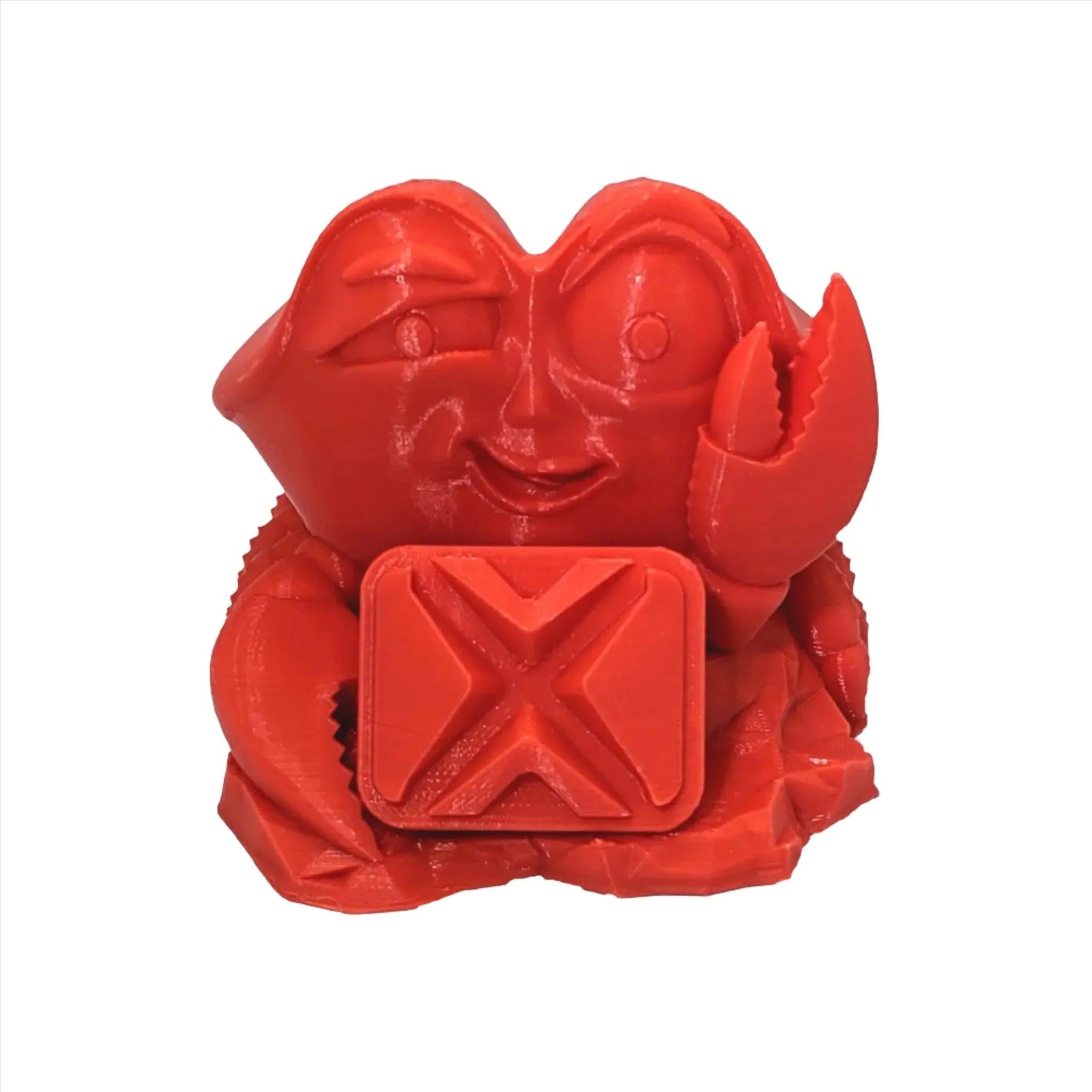 Red 3D printed cartoon crab figure made with PLA filament on white background