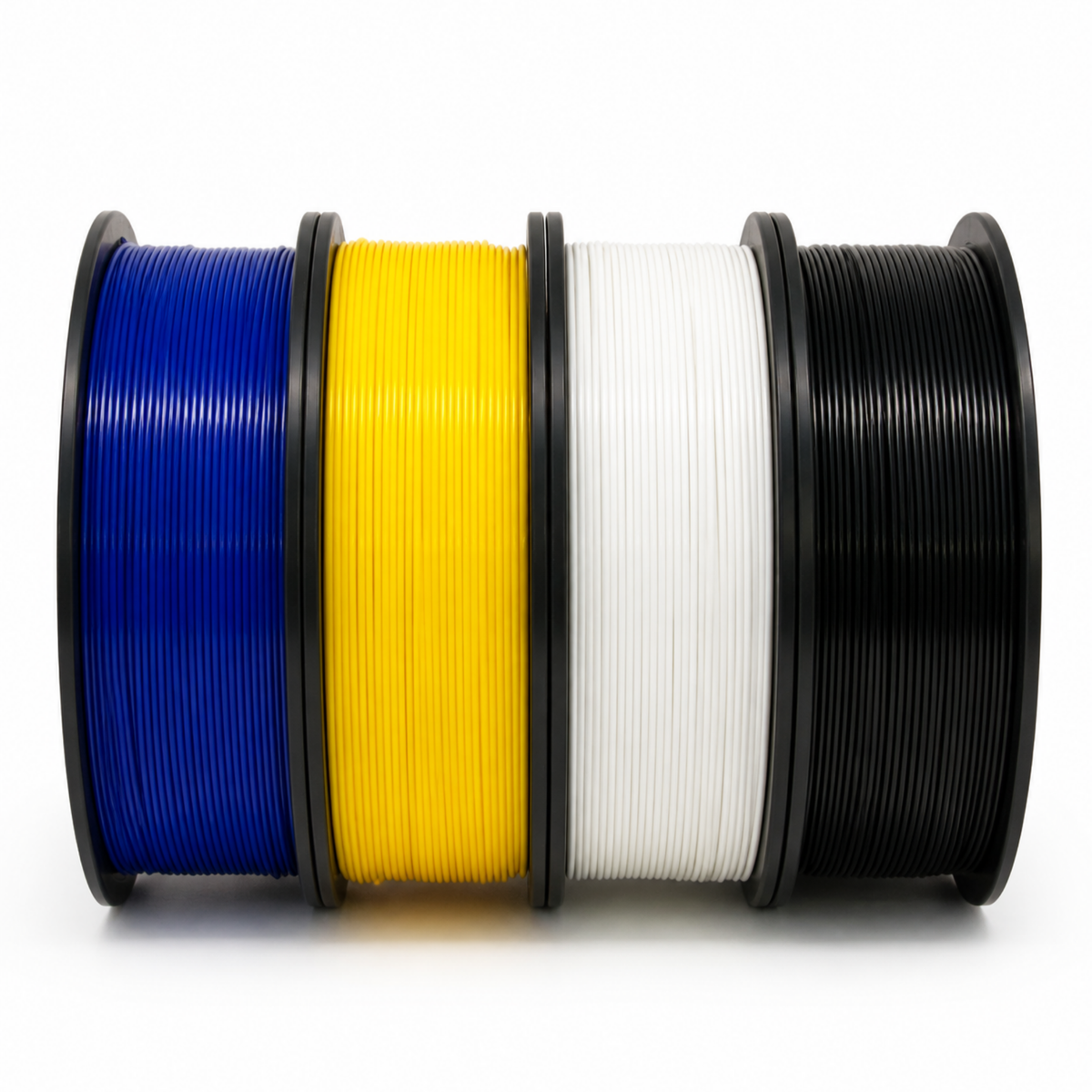 Four COEX 3D PLA spools side by side: Cobalt Blue, Taxicab Yellow, White and Black
